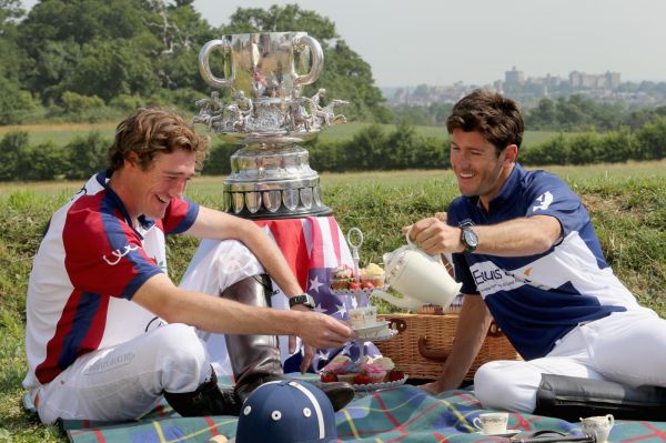 England captain Luke Tomlinson and American captain Nic Roldan (R) pose during a tea party prior to England competing against the USA in the Audi International Polo Westchester Cup on July 5, 2013 in Windsor, England. (Photo by Chris Jackson/Getty Images for Audi)
