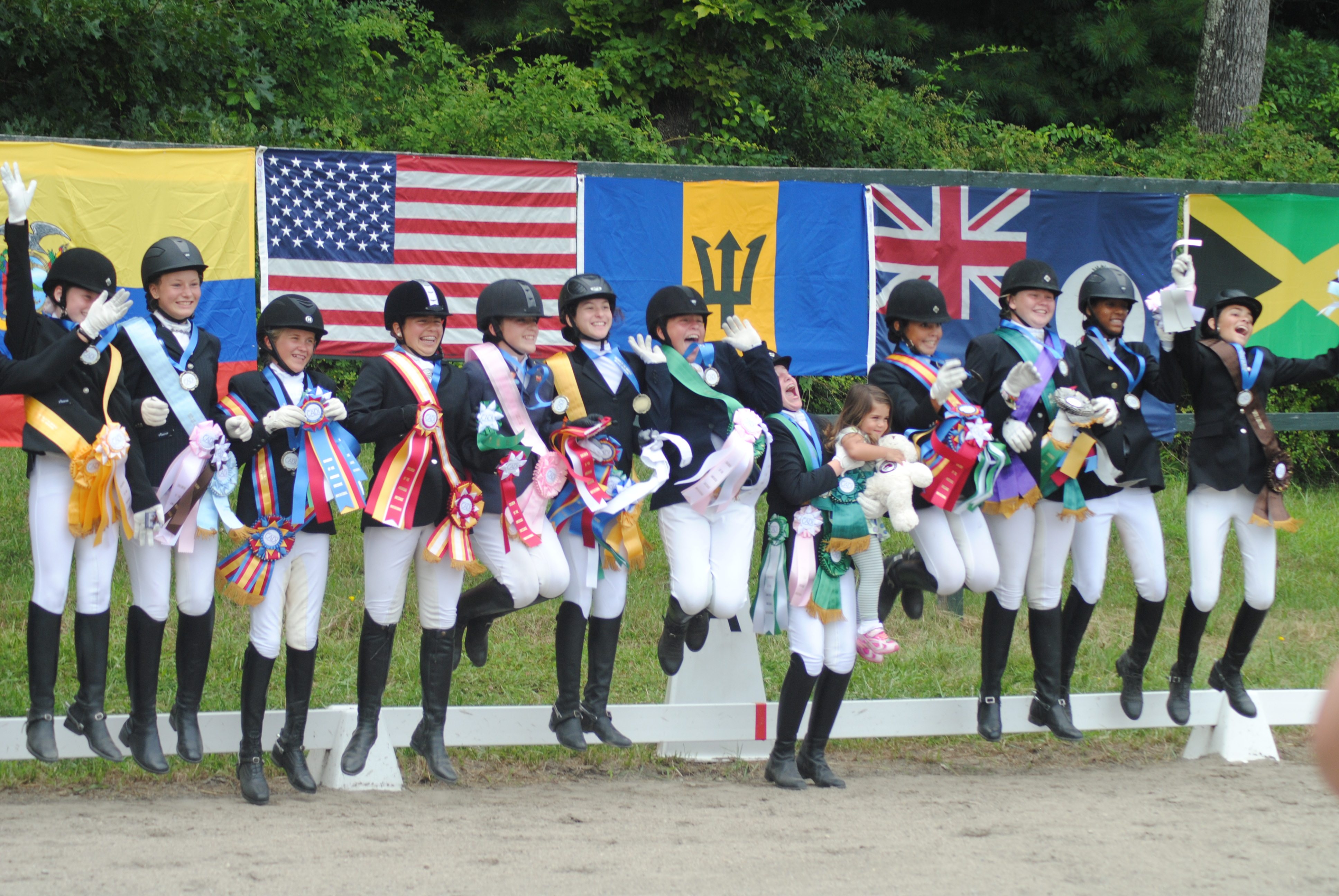 The riders pose for pictures together after the awards ceremony with their flags. This year riders from Barbados, Bermuda, Canada, Cayman Islands, Ecuador, Jamaica, Trinidad and Tobago and the United States came for CADI.