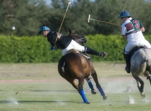 Casablanca's Hector Galindo (4) goes to back the ball with Palm Beach Equine's Luis Escobar (3) defending. Photo by Scott Fisher