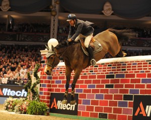 Italian rider Luca Moneta jumps to victory on his gallant mare Quovo de Vains to win the Alltech Christmas Puissance at Olympia, London. Credit: Kit Houghton.