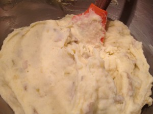 Creamy mashed potatoes blended up and ready to go in their piping bag.