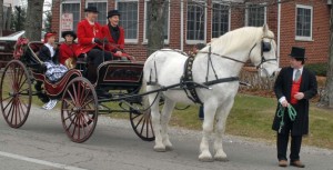19-Nancy Jackson, Maineville, Ohio, the President of the Ohio Valley Carriage Club (OVCC), and her Percheron gelding Buck (then 24 years old) pulling her crane necked brett carriage built around 1840 by a company in Newark, New Jersey, in the 2012 Lebanon Christmas Carriage Parade. They participated in 15 previous Lebanon parades, but Buck is now in semi-retirement at age 26, so Jackson did not drive in the 2014 parade. However, Jackson was an out walker for another carriage driver this year. The Jacksons purchased the brett on e-Bay and it was restored by her husband over a six-year period.  Photo by Nancy’s father-in-law Don Cox