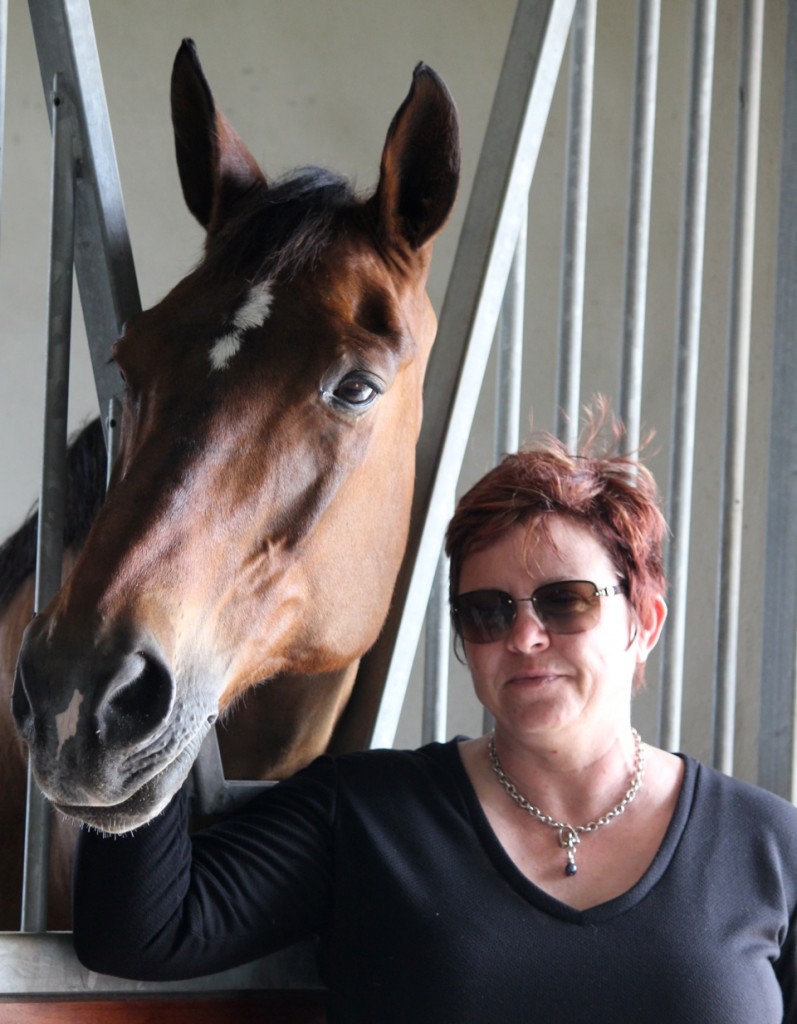Tami enjoys a moment with Feliki – a horse who has taught Tami how to live  Photo by Johnny Robb 