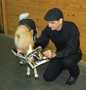 What do educated horses read? Sidelines Magazine, of course. Hamlet, a Miniature Therapy Horse from Gentle Carousel Miniature Therapy Horses in Gainesville, Florida, enjoys reading the March issue of Sidelines with Gentle Carousel founder Jorge Garcia-Bengochea. Gentle Carousel’s trip to Newtown, Connecticut was featured in “The Bottom Line” in the March issue. Let your horse read it, too!