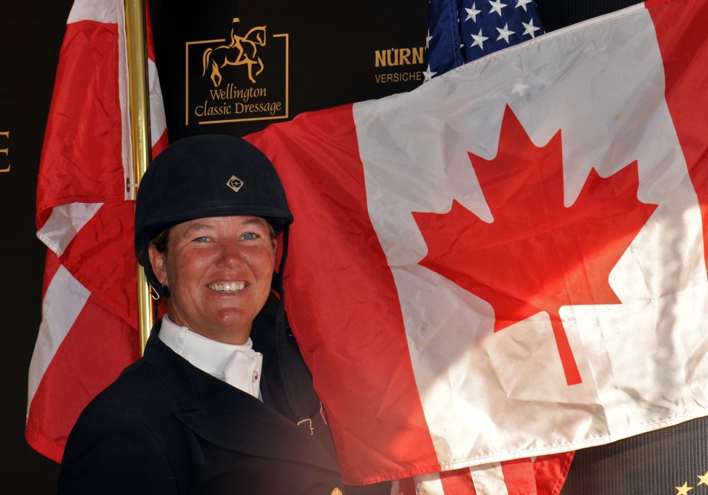Oh, Canada! Jacqueline Brooks shows national pride following her great finish with D-Niro at the 2013 World Dressage Masters. Photo by Shelley Higgins/MacMillan Photography