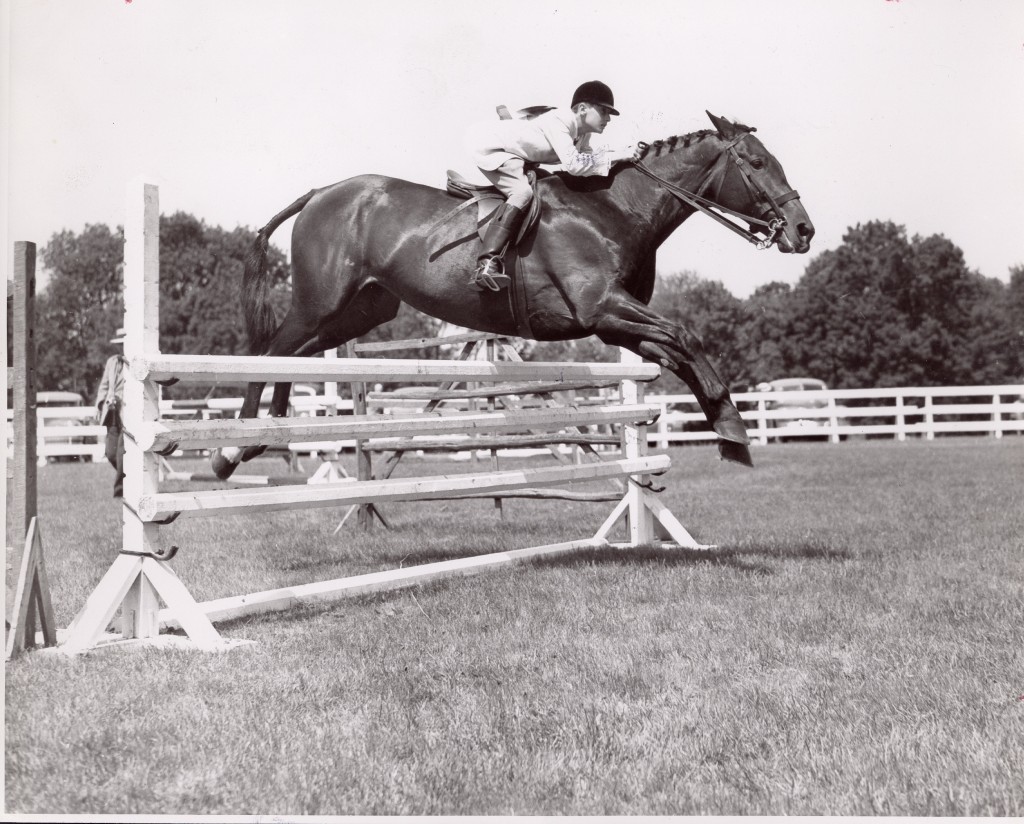 George, in 1950, shows off his amazing form over fences.  Carl Klein Photo courtesy of The Chronicle of the Horse 