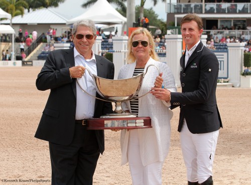 Jane Clark was presented with the 2014 Harrison Cup Perpetual for the performance of her horses Cella, Urico and Aristo Z at the Winter Equestrian Festival under the ride of Ben Maher. Left to right: Hunter Harrison, Jane Clark and Ben Maher. Photo by Kenneth Kraus.  