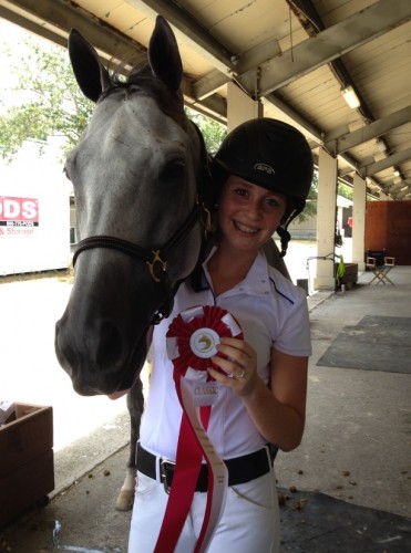 Ariel celebrates their 2nd Place win in the Child/Adult Classic at the ESP Summer Show in Wellington.