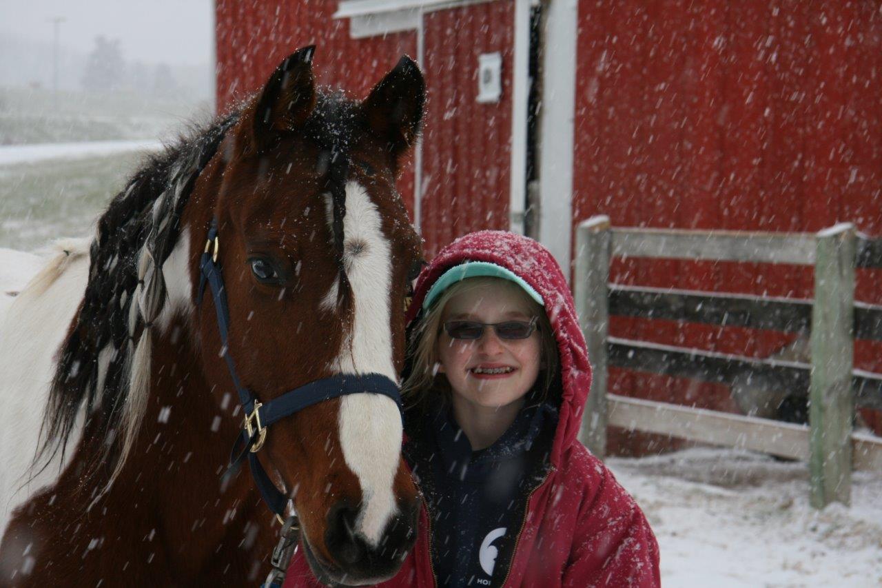 Seppy and Karissa after a ride in the snow.  (Photo courtesy of Lorie Hagl)