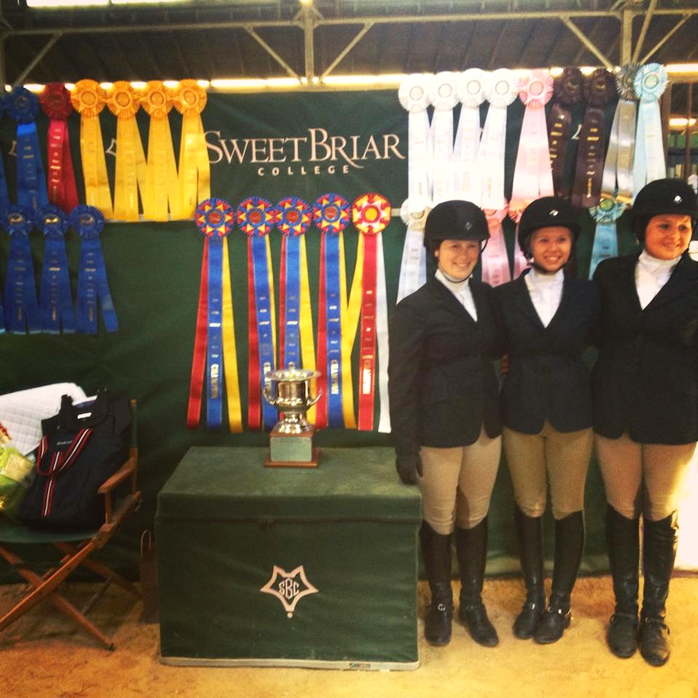 Sweet Briar's Novice team poses with rosettes, tri-colors and trophies. (Photo by Mimi Wroten ’93)
