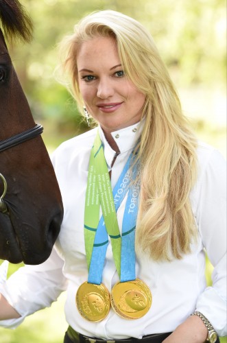 Marilyn Little with her team and individual eventing gold medals from the 2015 Pan Am Games in Canada.