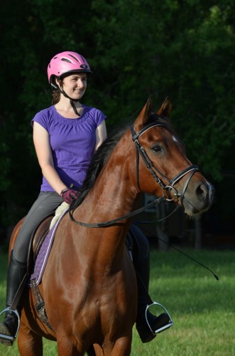 Allana riding Benny in July 2015, sporting a pink helmet — pink for breast cancer awareness!