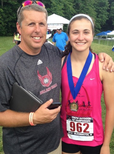 Lizzie with her coach Brian Thompson after winning the USATF Youth National Championship.