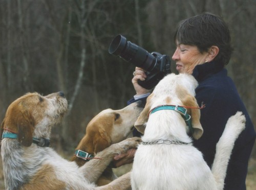 Artist Yvonne Todd enjoys a moment with some hounds.