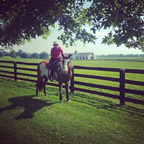 Meagan and Max, her first reining horse, enjoying a trail ride in Kentucky. Photo courtesy of Meagan Nusz