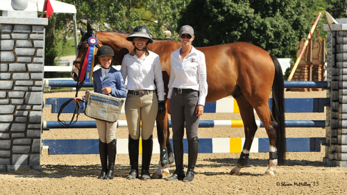 Taje and Drommels captured the Low Children’s Championship at WEF. From left to right: Gustavo Murcia, Taje, trainer Maggie Gould and groom Leo. Photo by SportFot