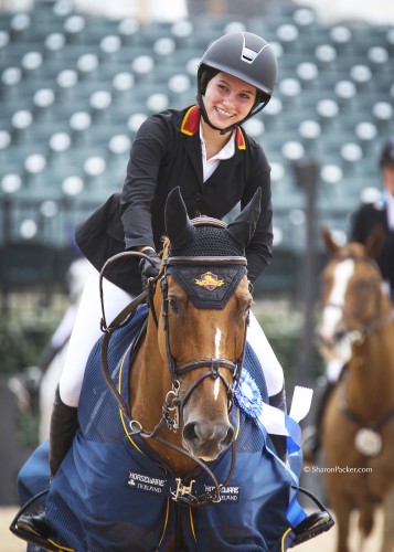 Carly is all smiles after winning the $5000 Low Junior/AO Classic at the Tryon International Equestrian Center. Photo by Sharon Packer, sharonpacker.com