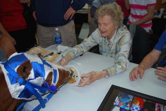 Penny Chenery, the real-life owner of Secretariat, feeds Patrick a treat.