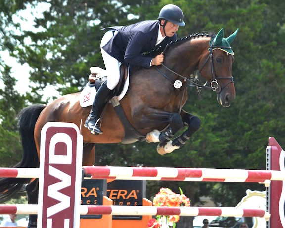 Alpha Omega Farm's Pernod and Gavin clearing the CWD jump in the Grand Prix at HITS Culpeper during the 2015 season. Photo by Susan McClafferty