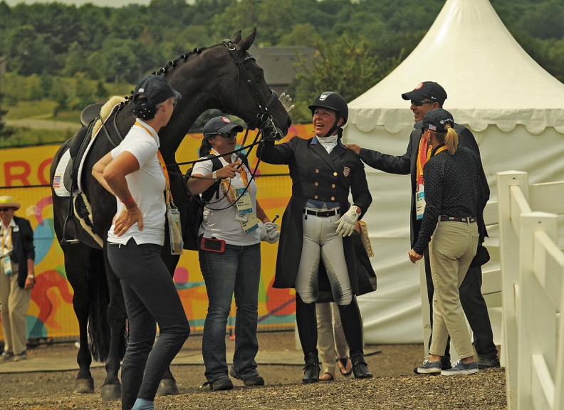 Kim enjoying a moment with her team at the Pan Am Games. Photo by Kim MacMillan/MacMillan Photography