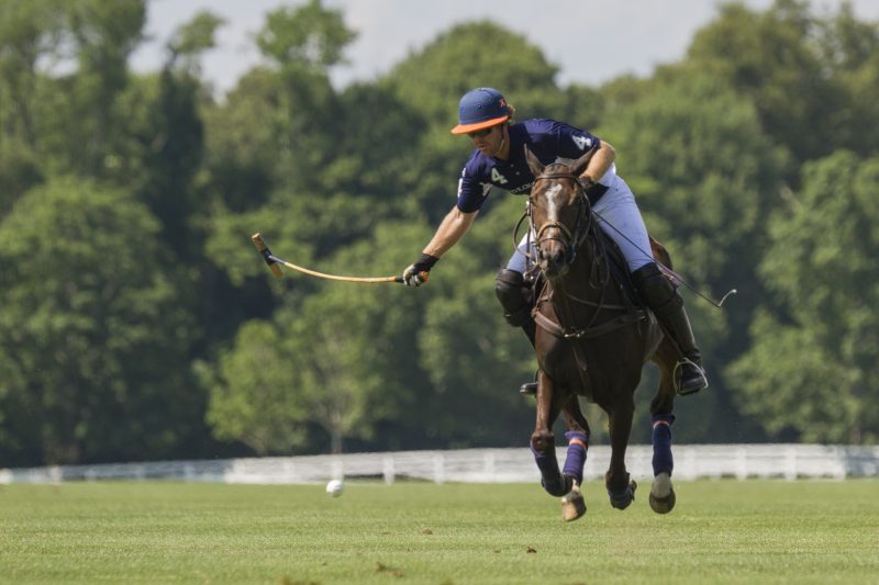 Kris and his pony catch some air as they race after the ball. Photo by Katerina Morgan