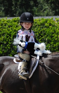 A young rider enjoys the Menlo Charity Horse Show. Photo by Drew Altizer