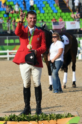 Phillip earning his first individual Olympic medal. Photo by Allen MacMillan/MacMillan Photography