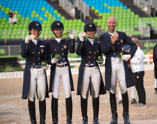 Dressage Team Medals: The U.S. Dressage Team shows off their bronze medals. From the left: Allison Brock, Laura Graves, Kasey Perry-Glass and Steffen Peters.