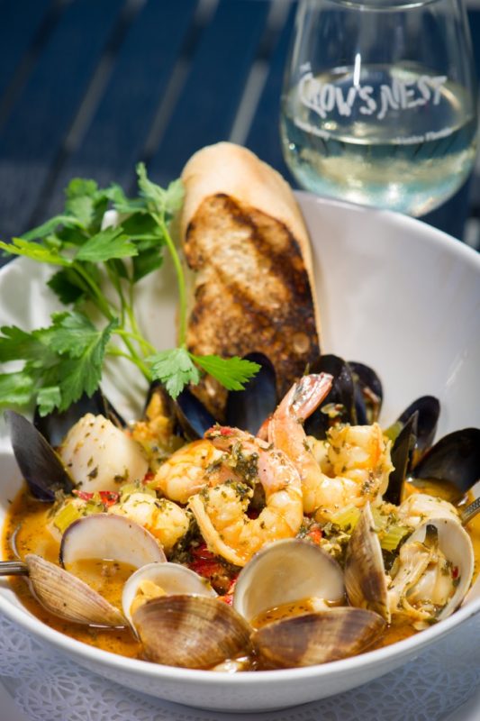 Bouillabaisse and a glass of wine make for the perfect evening.