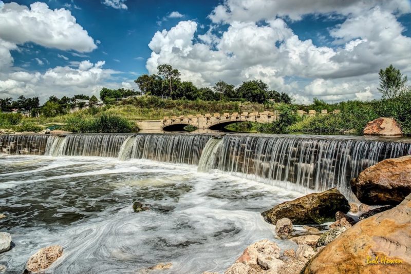 The River Walk includes beautiful stone bridges and waterfalls. Photo courtesy of VisitSanAntonio.com, photographer Bob Howen