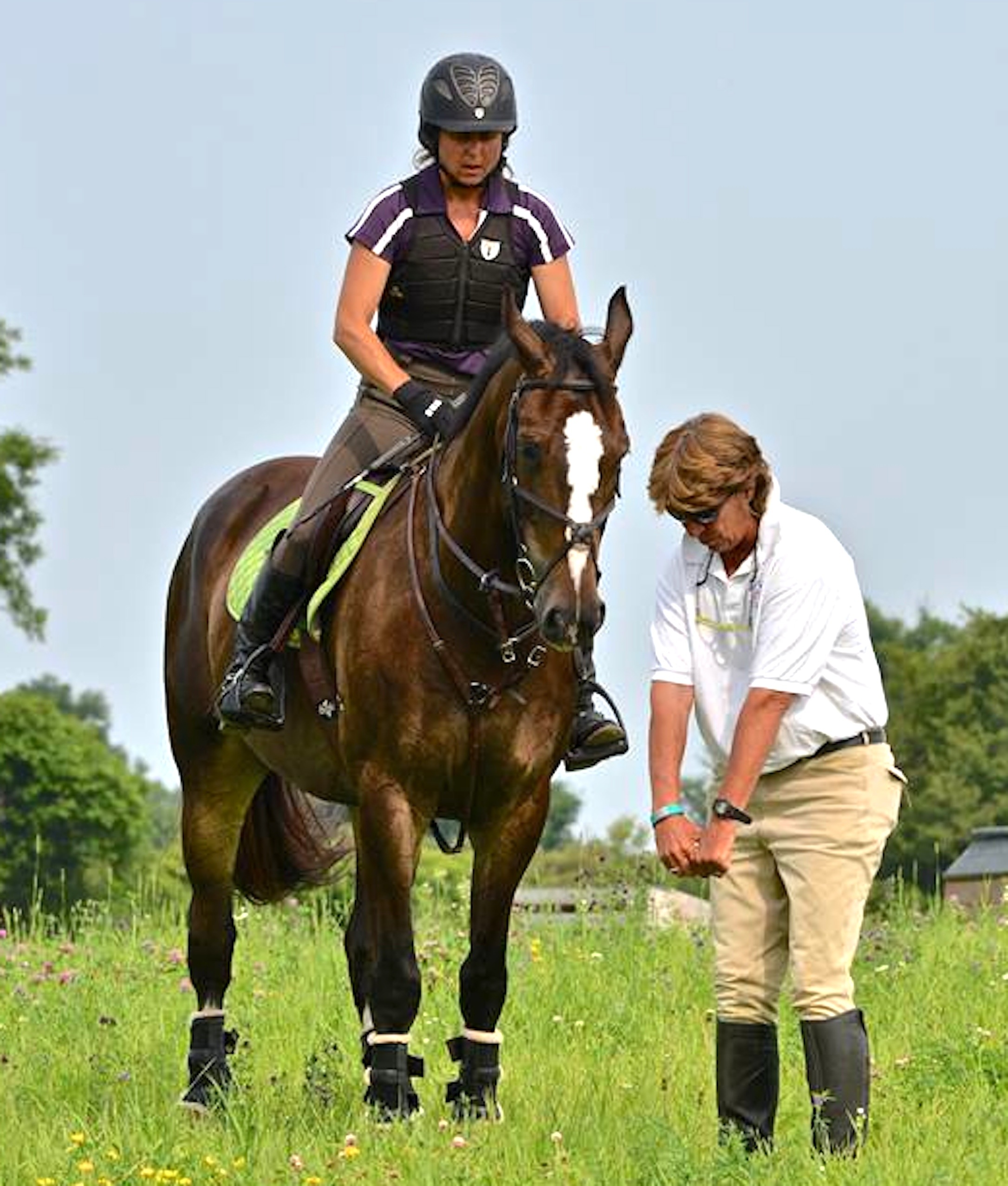 Cathy coaches Tamara Toro aboard Oliver Darby at the 2014 Sprucehaven Farm eventing clinic in Canada. (Photo by Ian Woodley)