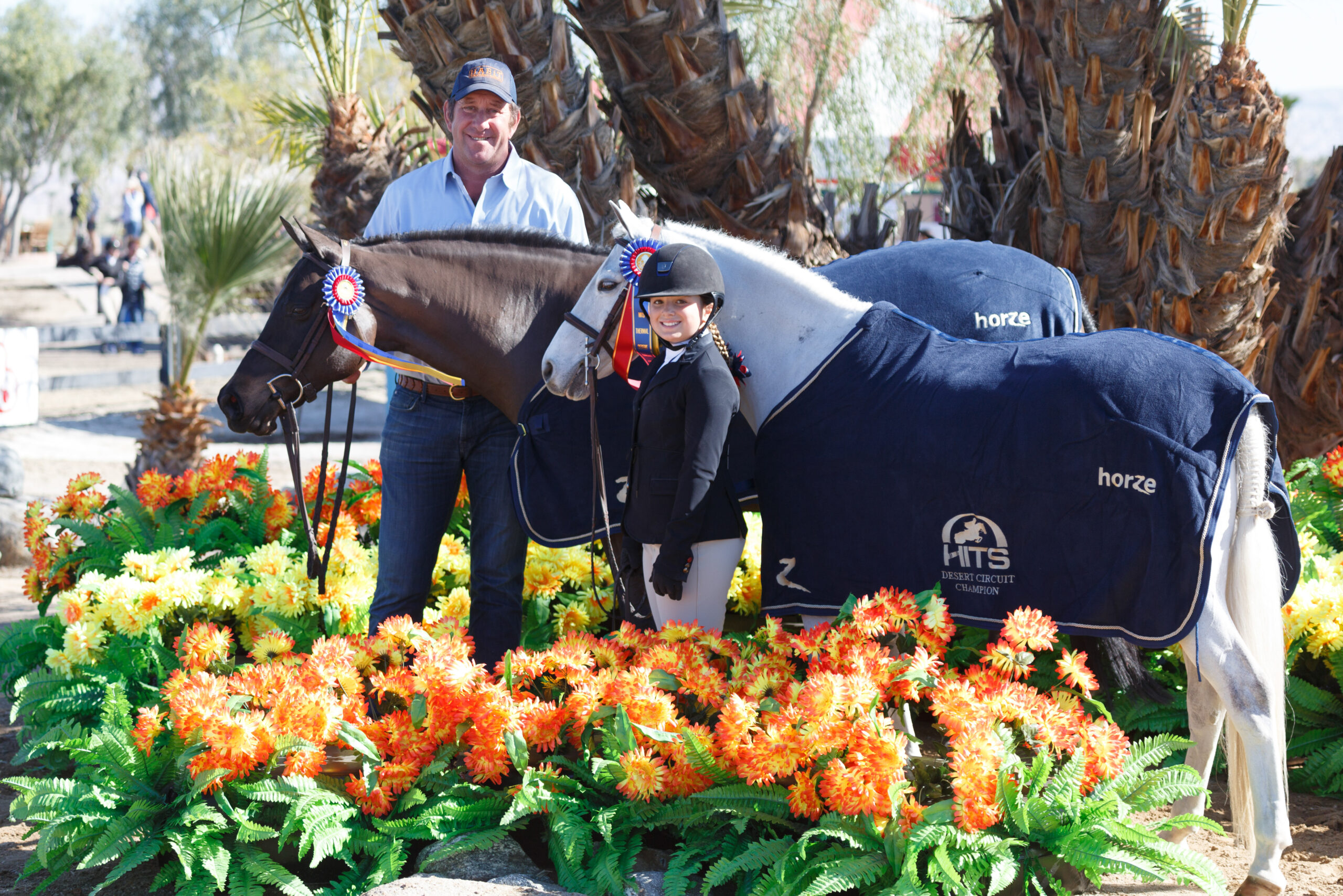 Stella and trainer Archie Cox with HITS Thermal Championship ponies Trillville and Blueberry Hill Photo by Laura Wasserman