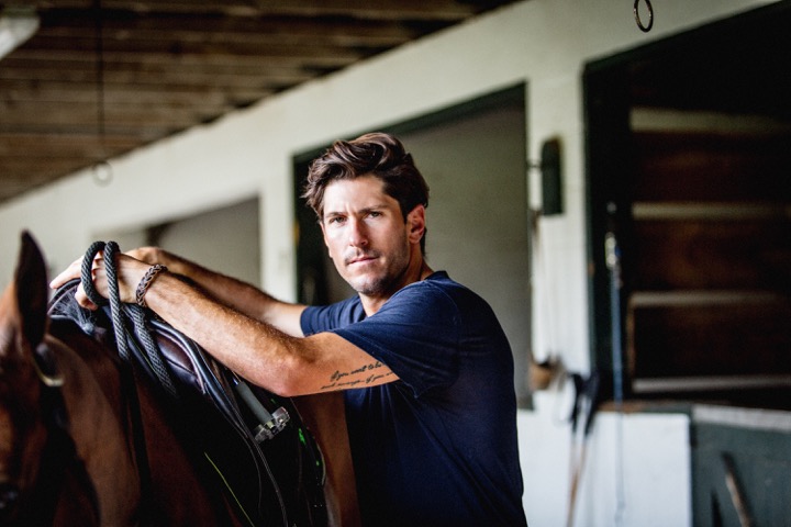 Nic in one of the Ganzis’ barn at South Forty Polo Club in Wellington. Nic plays for Grand Champions Polo Club, owned by Marc and Melissa Ganzi, who have long supported his polo career. Photo by Juan Lamarca, <a href=