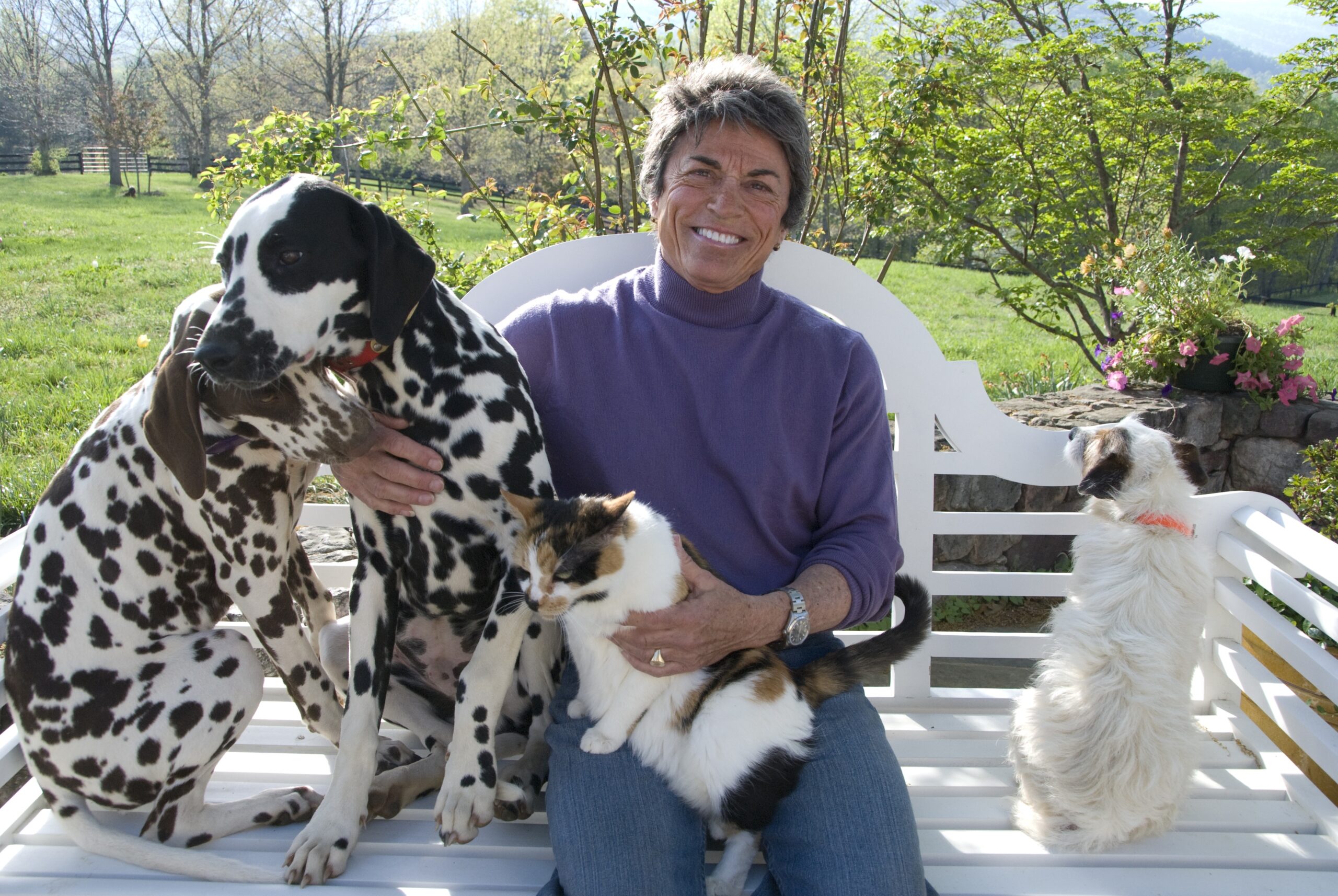 Rita Mae at home with her household pets. The Jack Russell Terrier on the right seems to have an opinion about having his photo taken. Photo by Mary Motley Kalergis