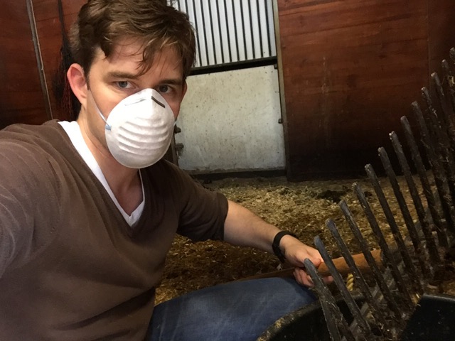 Timothy looks prepared as he tackles cleaning a stall — an activity that a horse hubby often has to undertake.