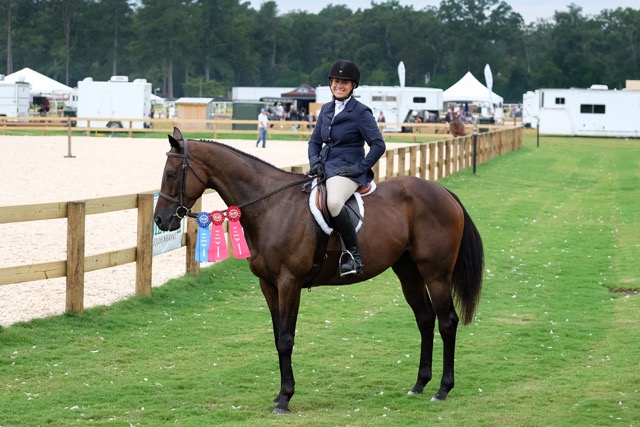 Caitlin and Azorian proudly show off their ribbons.
