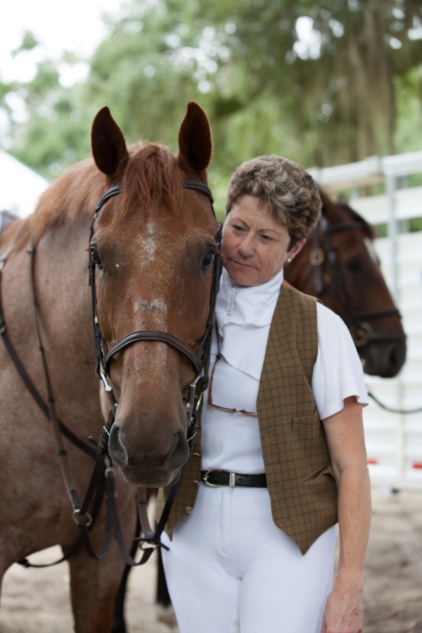 Sue spends a sweet moment with Dustin, her strawberry roan (pink!) horse who was her therapy during her recovery from breast cancer.