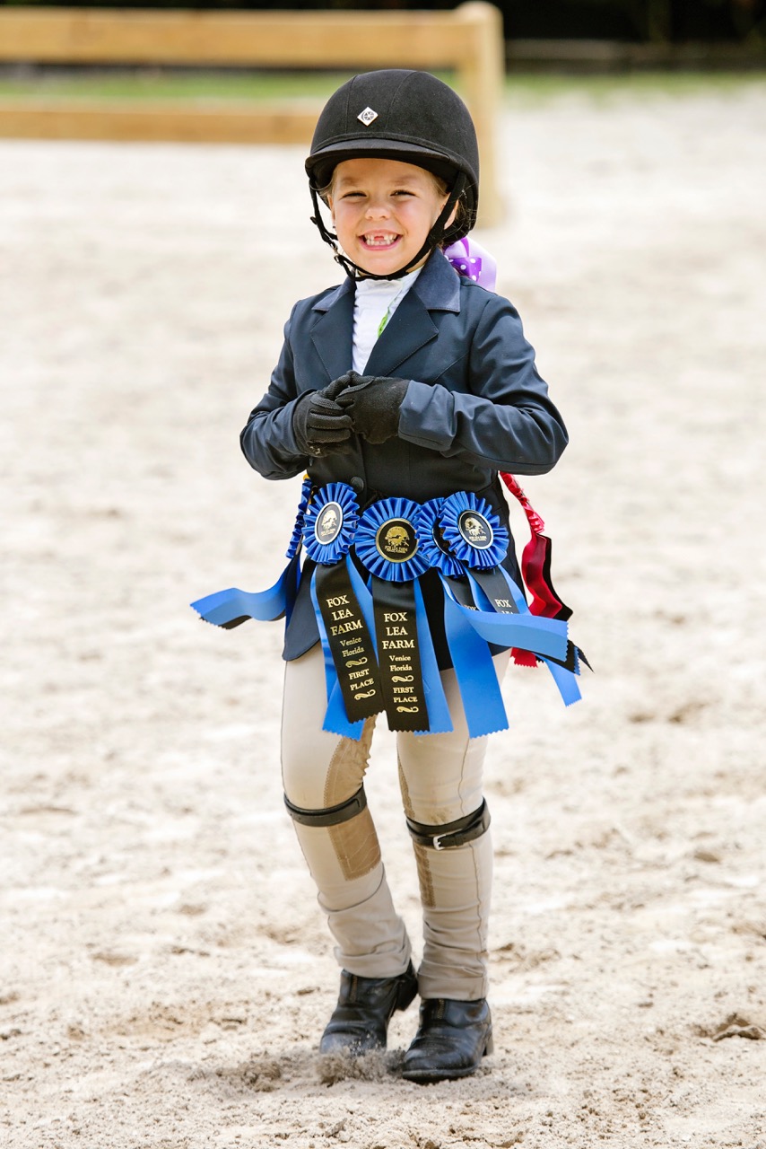 A young rider is all smiles during a Fox Lea Farm horse show. Photo by Victoria DeMore