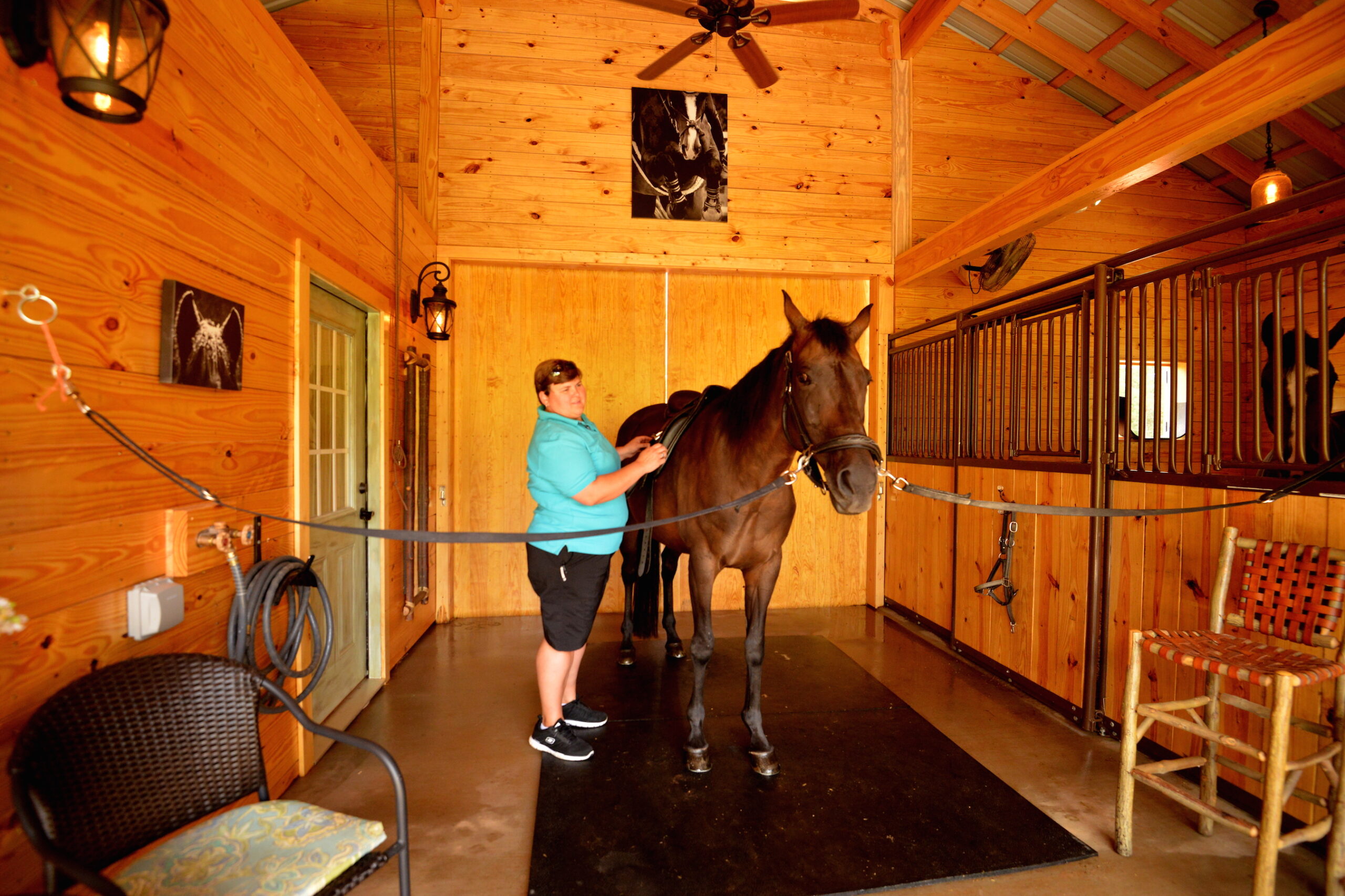 Vicki does a saddle fitting on Bella at Dolce Farm in Tryon, North Carolina. Photo by Linda Valerio Stenzel Photography