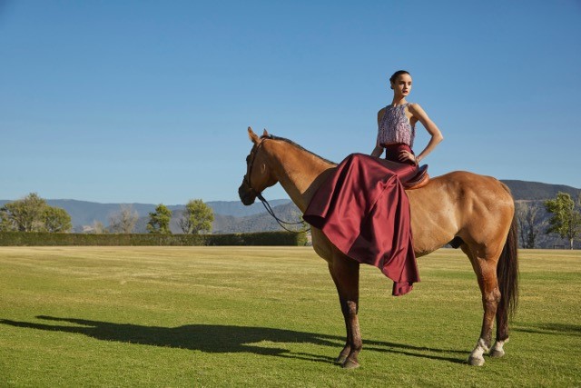 Zinta strikes a beautiful pose in a Badgley Mischka Couture beaded sequin and fringe top, $1,290, and a Badgley Mischka Couture silk mohair mermaid skirt, $1,715. Both available at Badgley Mischka’s Rodeo Drive store in Beverly Hills, California.