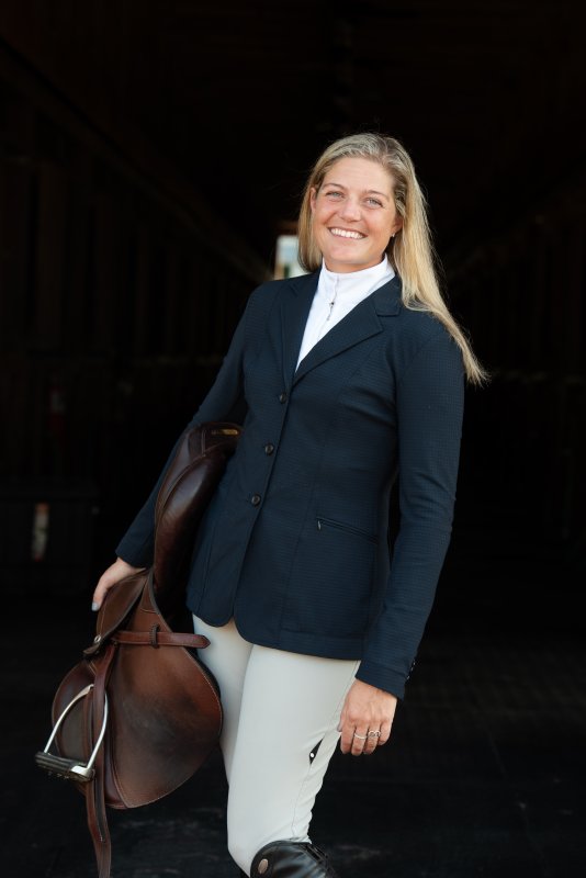 Brooke works as a realtor to support her riding.