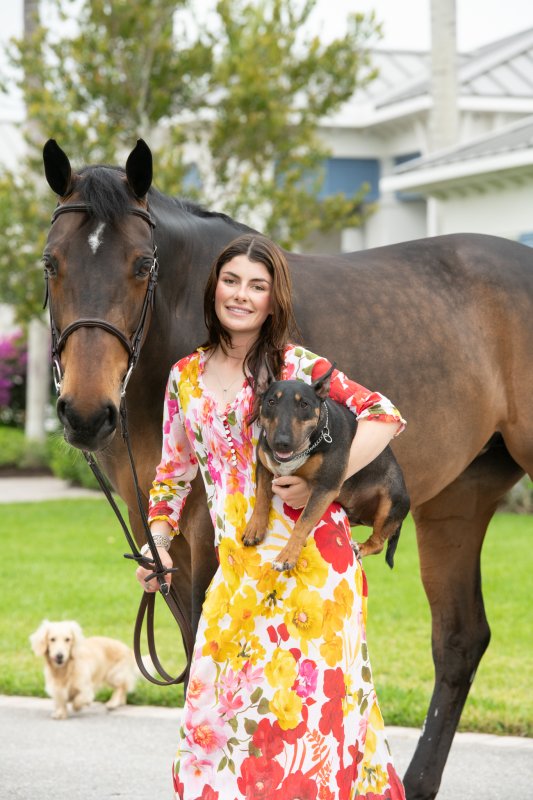 Baylee with her dog Drummer and her horse Formidable.