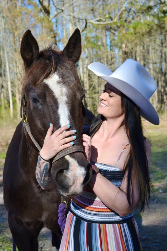 Sydney and Bertha. Sydney's father surprised her with the mare after discovering how much she reminded her of Belle.