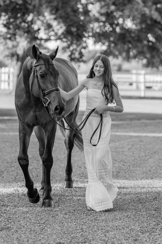 Grace and her Junior Hunter horse Adler.